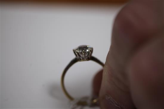 An 18ct gold and platinum solitaire diamond ring, size T.